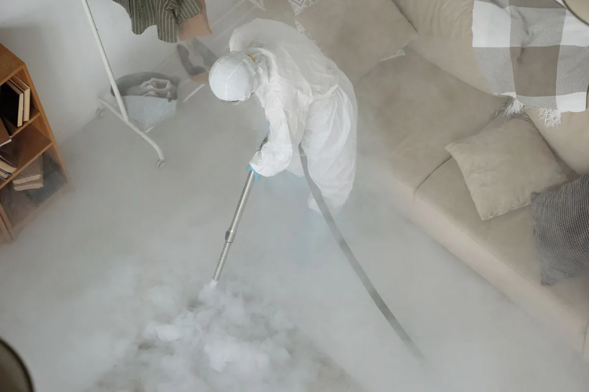 Biohazard cleanup technician in protective equipment, Wakefield, KS